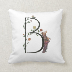 B est pour le coussin d'ours et de bégonias !