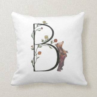 B est pour le coussin d'ours et de bégonias !