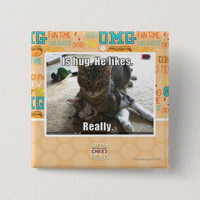 Badge Carré 5 Cm Est l'étreinte. Il aime (Devant)