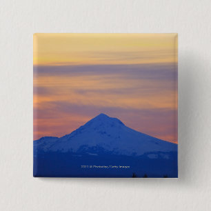 Badge Carré 5 Cm Montagne bleue couverte par neige orange de ciel