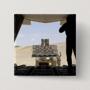 Badge Carré 5 Cm Un chariot élévateur transporte du fret sur un Her