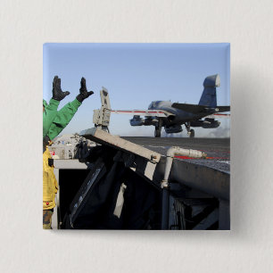 Badge Carré 5 Cm Un Prowler EA-6B démarre depuis le poste de pilota