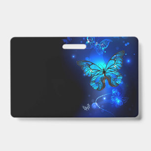 Badge Papillon Morpho sur fond sombre