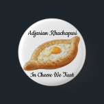 Badge Rond 2,50 Cm Adjarian Khachapuri<br><div class="desc">Adjarian Khachapuri is a traditional Georgian dish from the region of Adjara, located along the Black Sea coast of Georgia. It is a boat-shaped bread made from soft yeast dough, filled with melted cheese, and topped with a fresh egg yolk and a slice of butter. Before eating, the egg and...</div>
