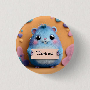 Badge Rond 2,50 Cm Hamster bleu bouffant tenant un signe avec nom