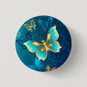 Badge Rond 2,50 Cm Papillons d'or sur un Arrière - plan bleu