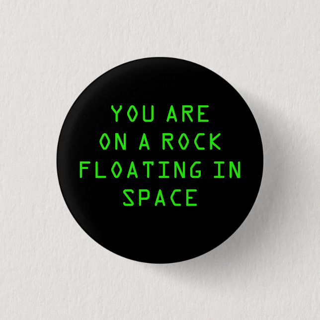 BADGE ROND 2,50 CM "VOUS ÊTES SUR UNE ROCHE FLOTTANT DANS L'ESPACE" (Devant)