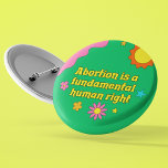 Badge Rond 5 Cm Abortion is a Fundamental Human Right Feminist<br><div class="desc">Abortion is a fundamental human right written in retro yellow font on a funky hippie style button for a pro choice feminist. Show off your fun spirit with this cute green button with pretty flowers while also standing up for women's rights and the pro-choice movement.</div>