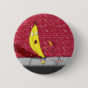 Badge Rond 5 Cm Banane glissant sur un bouton de personne