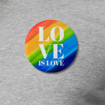 Badge Rond 5 Cm L'amour est la fierté de l'amour Arc-en-ciel<br><div class="desc">Ce bouton Pride est décoré avec LOVE IS LOVE en caractères blancs gras sur un arc-en-ciel d'aquarelle arrière - plan de rouge,  orange,  jaune,  vert,  bleu et violet. Aquarelle originale © Michele Davies.</div>