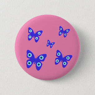 Badge Rond 5 Cm Papillons bleus mal oeil avec Arrière - plan rose