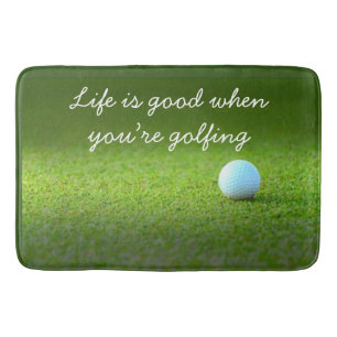 Bain Golf Life est bon avec balle de golf sur le tapis