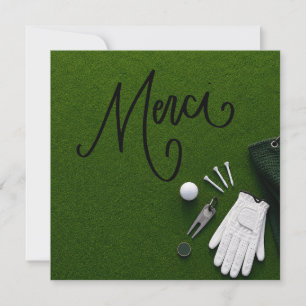 Balle de golf avec le mot merci sur le green