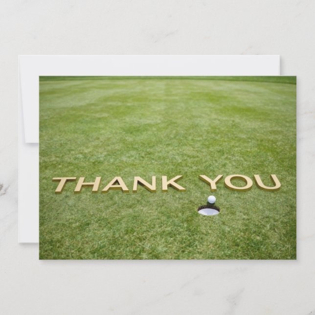 Balle de golf avec le texte Merci sur de l'herbe v (Devant)