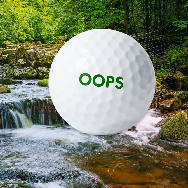 Balles De Golf Humour drôle 'Oops' Blague Originalité (A funny novelty golf ball with 'Oops' caption in green on a classic white background)