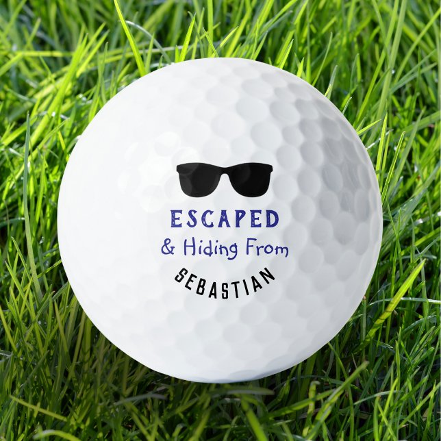 Balles De Golf Lunettes de soleil drôles et cool Échappées et cac (A funny personalized golf ball with dark sunglasses picture and 'escaped and hiding' caption)
