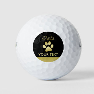Balles De Golf Paw chien brillant or sur arrière - plan noir