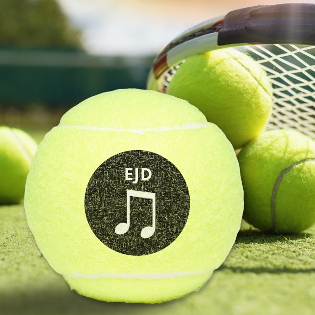 Balles De Tennis Note musicale Musique monogramme Amateurs de Tenni (A monogrammed tennis ball with musical notes design on a black circle)