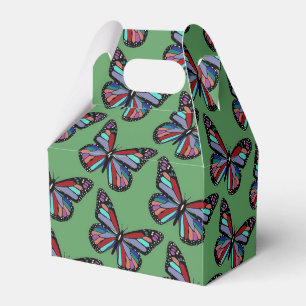 Ballotins Motif de papillon coloré assez orné sur fond vert