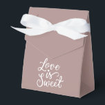 Ballotins Rose minimaliste Gold et Mariage blanc<br><div class="desc">Sacs cadeaux mariages remarquables en couleur or Rose qui feront ressortir votre cadeau. Chaque sac est orné d'une inscription romantique "L'amour est doux",  ajoutant un charme délicat et un style unique à votre cadeau. Faites votre cadeau encore plus spécial avec nos sacs-cadeaux mariages exquis.</div>