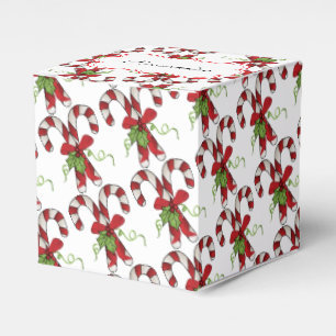 Ballotins Sucres de canne de rayure avec le houx et l'arc