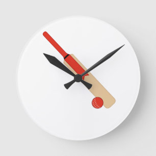 Bat rouge de cricket et horloge murale de balle