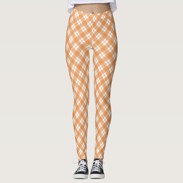Beige and white checkered leggings displayed  (Devant)