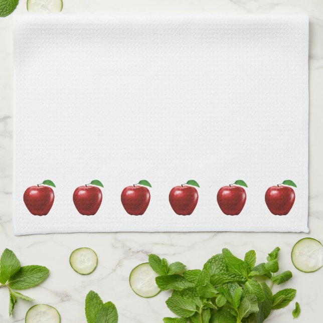 Belles pommes rouges sur une serviette de cuisine  (Plié)
