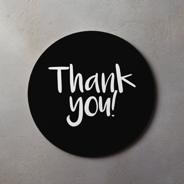 Black and white fun text merci sticker (Black and white fun text thank you sticker.)