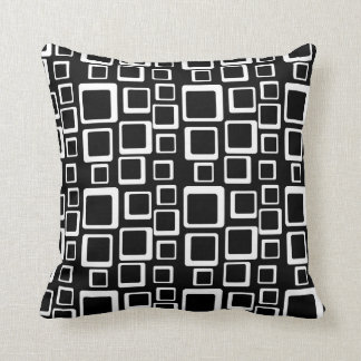 Blanc sur le coussin noir d'années '60 de