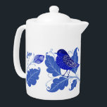 Bleu Oiseau Folk Art Nordic Teapot<br><div class="desc">Voici une jolie théière avec une image d'art populaire de bleuets et de feuillage qui s'habillera sans aucun doute n'importe quelle table ! Le bleuet est assis sur une brindille avec des feuilles bleus. L'image est mise en miroir au centre, de sorte que le second côté a l'oiseau et les...</div>