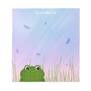 Bloc-note caricature grenouille fouiller à travers les libel