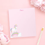 Bloc-note Magique Arc-en-ciel Unicorn rose Personnalisé<br><div class="desc">Un beau bloc-notes à licorne avec étoiles et un arc-en-ciel sur un arrière - plan rose clair. Personnalisez avec son nom pour faire un cadeau amusant pour une fille!</div>