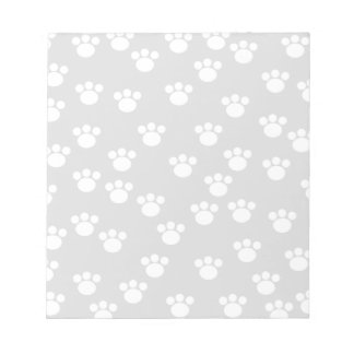 Bloc-note Motif Empreinte de patte blanc et gris clair.