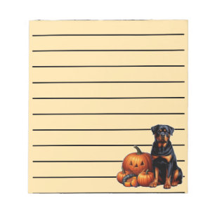Bloc-note Rottweiler assis à côté de citrouilles d'Halloween