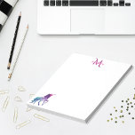 Bloc-note unicorne violet blanc monogrammé<br><div class="desc">Une licorne d'imaginaire turquoise,  violette et un peu rose. Arrière - plan blanc. Modèle pour Votre nom une lettre monogramme en violet et rose.</div>