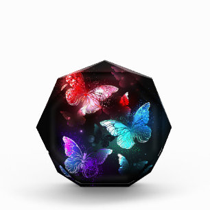 Bloc Photo Trois papillons brillants sur l'arrière - plan de