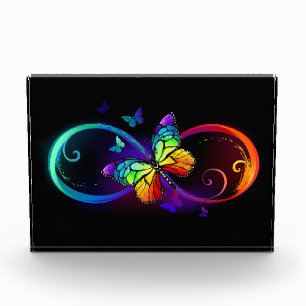 Bloc Photo Vibrant infinity with rainbow butterfly on black