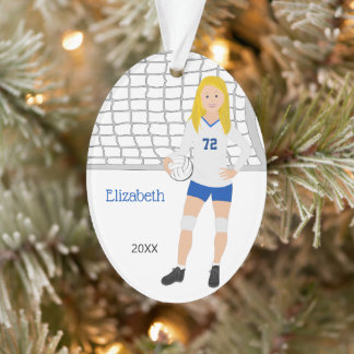 Blonde féminine de volley-ball en bleu et blanc