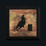 Boîte À Souvenirs Barrel Racing Girl Silhouette on a Grunge Texture<br><div class="desc">Illustration passionnante et rustique sur le thème du rodéo. Silhouette d'un tonneau de cow-girl qui courait avec son cheval. Arrière - plan est une texture grossière brun et rouge tonique patiné. Idéal pour les amateurs de rodéo et de cheval.</div>