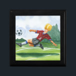 Boîte À Souvenirs Joueur de football à la balle par Jay Throckmorton<br><div class="desc">Un ballon de football est suspendu dans l'air,  en attendant le coup de pied vicieux que le joueur est en train de livrer. Peut-il plier comme Beckham ? Un joli morceau à accrocher sur votre mur ou à offrir en cadeau aux amateurs de football de votre vie!</div>