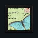 Boîte À Souvenirs Papillon à ailes bleues sur carte postale Turquois<br><div class="desc">Cette carte postale turquoise porte un message de beauté. Un délicat papillon à ailes bleues repose sur la carte,  obscurcissant une partie du script qu'il contient. Cette impression de Vision Studio ferait un grand ajout à votre maison!</div>