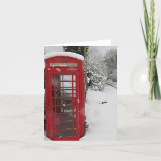 Boîte téléphonique dans une carte de neige blanche