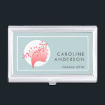 Boîtier Pour Cartes De Visite Corail et bleu Simple femme Silhouette<br><div class="desc">Un simple design de porte-cartes de visite bleu poussiéreux avec un logo féminin en corail et blanc représentant la tête d'une femme ornée d'une guirlande feuillue, ce design travaille magnifiquement pour les maquilleurs, les salons de cheveux et d'ongles, les spas, l'industrie de la mode ou les entreprises qui fournissent soins...</div>
