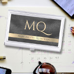 Boîtier Pour Cartes De Visite Élégant Monogramme Or Cuir Noir Nom élégant<br><div class="desc">Faites une impression durable avec notre Elégant Monogramme en cuir noir or Nom élégant Boîtier de carte de visite! Le design présente une texture en cuir noir luxueuse accentuée par une bande de papier doré chic, offrant un cadre parfait pour votre personnage professionnel. Personnalisez-le avec votre nom complet et un...</div>