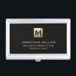 Boîtier Pour Cartes De Visite Monogramme d'or brossé noir<br><div class="desc">Elevez votre look professionnel avec ce coque carte de visite élégant et pratique. Avec un médaillon de monogramme brossé avec votre nom de société et titre en typographie de bloc classique, ce coque est un excellent moyen de garder vos cartes de visite organisés et protégés. L'élégant arrière - plan noir...</div>
