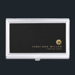 Boîtier Pour Cartes De Visite Monogramme minimal en or brossé noir<br><div class="desc">Conception monographique minimaliste avec typographie de bloc classique médaillon de monogramme métal brossé or avec nom et titre personnalisés ou texte personnalisé ci-dessous sur un simple arrière - plan noir. Personnalisez pour votre usage personnalisé.</div>