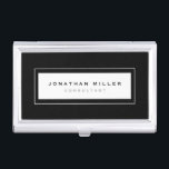 Boîtier Pour Cartes De Visite Nom et titre du cadre noir et blanc professionnel<br><div class="desc">Le porte-carte de visite professionnel présente un design épuré et minimaliste dans une palette de couleurs noir et blanc. Nom et titre personnalisés présentés sur un simple arrière - plan blanc, encadrés dans une bordure élégante sur un arrière - plan noir. Présenté avec un nom et un titre personnalisés en...</div>