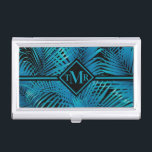 Boîtier Pour Cartes De Visite Palmes noires Turquoise Monogramme<br><div class="desc">Face de palmier tropicale en bleu turquoise sur noir, ce porte-carte est idéal pour les cartes de visite, les cartes de crédit, les cartes cadeaux, et dispose de votre monogramme en lettrage chic sur le devant. Créez-vous pour vous-même ou offrez-en un cadeau. MATCHING coque iphone, d'autres coques ipad et plus...</div>