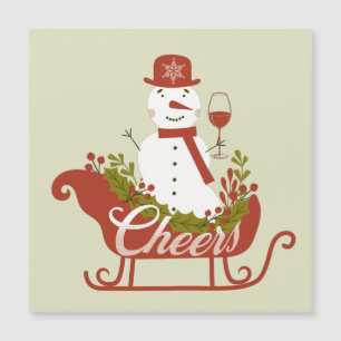 Bonhomme de neige qui trinque avec du vin et un tr